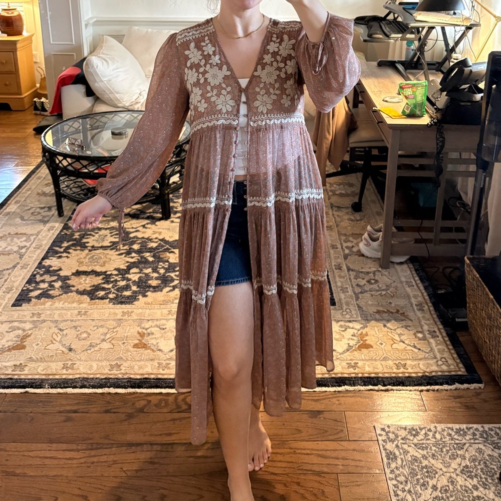 Embroidered button duster
